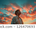 男人的側面和日落天空背景 - AI 生成的素材 126470693