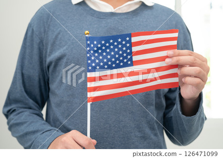 Learn English language, Asian teenage student hold US America flag in course at school. 126471099