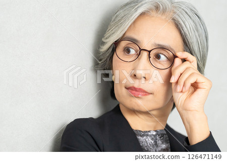 Senior women wearing glasses Senior women wearing glasses 126471149