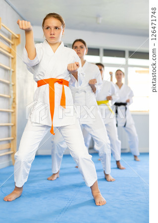 Teenage girls in kimono doing kata training 126471748