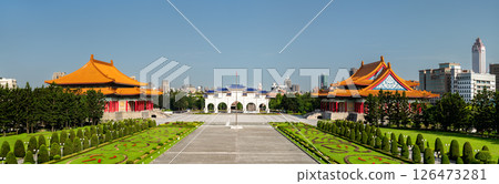 Panoramic view of Liberty Square in central Taipei, flanked by the National Theater and National Concert Hall with the grand gate in the background, surrounded by symmetrical gardens and urban skyline 126473281