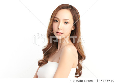 A beautiful young Asian woman with clean, fresh skin against a white background. Skincare, facial treatment, cosmetology, beauty, and spa. An elegant portrait of an Asian woman. A beautiful young Asian woman with clean, fresh skin against a white background. Skincare, facial treatment, cosmetology, beauty, and spa. An elegant portrait of an Asian woman. 126473649