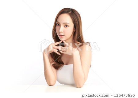 A beautiful young Asian woman with clean, fresh skin against a white background. Skincare, facial treatment, cosmetology, beauty, and spa. An elegant portrait of an Asian woman. A beautiful young Asian woman with clean, fresh skin against a white background. Skincare, facial treatment, cosmetology, beauty, and spa. An elegant portrait of an Asian woman. 126473650