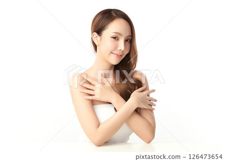 A beautiful young Asian woman with clean, fresh skin against a white background. Skincare, facial treatment, cosmetology, beauty, and spa. An elegant portrait of an Asian woman. A beautiful young Asian woman with clean, fresh skin against a white background. Skincare, facial treatment, cosmetology, beauty, and spa. An elegant portrait of an Asian woman. 126473654