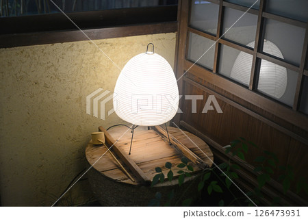 A lantern placed on top of a millstone at the Shikokumura water reservoir A lantern placed on top of a millstone at the Shikokumura water reservoir 126473931