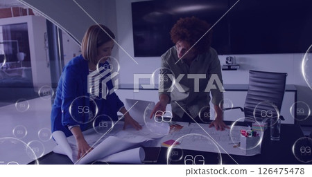 Image of 6g text over diverse colleagues discussing work in office 126475478