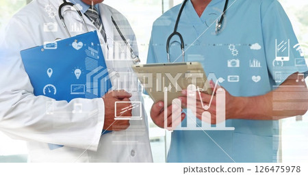 Image of data processing and diagrams over caucasian male doctors using tablet in hospital 126475978