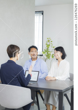 A middle-aged couple having a meeting 126476269