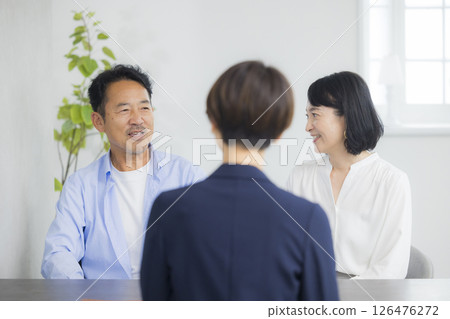 A middle-aged couple having a meeting 126476272