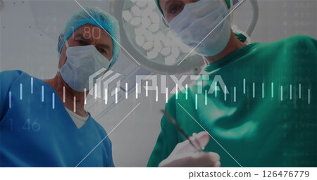 Image of data processing over caucasian surgeons during operation 126476779
