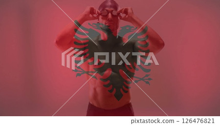 Image of flag of albania over caucasian male swimmer Image of flag of albania over caucasian male swimmer 126476821