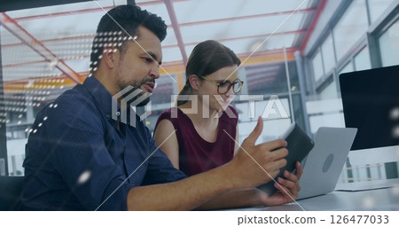Image of financial data processing over diverse colleagues discussing work in office Image of financial data processing over diverse colleagues discussing work in office 126477033