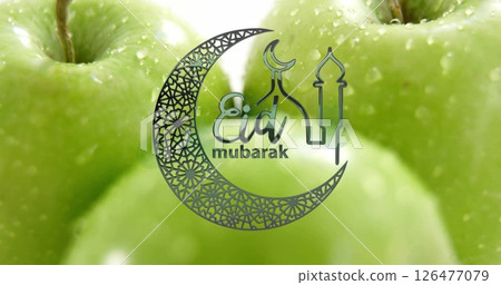 Eid Mubarak text image over close-up of green apples with water droplets 126477079