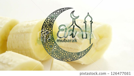 Eid Mubarak text image over sliced bananas background 126477081