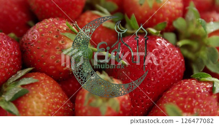 Eid Mubarak text image over close-up of fresh strawberries 126477082