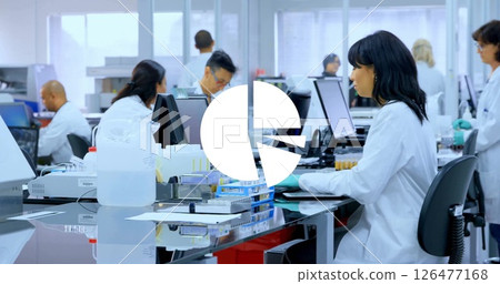 Image of diagrams over diverse scientists working in lab 126477168