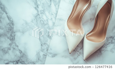 Elegant white stiletto heels on luxurious marble background, bridal fashion concept with copy space for text 126477416