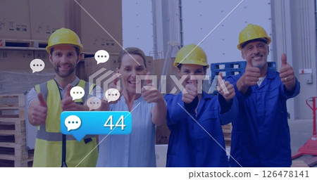 Image of media icons over caucasian workers with thumbs up 126478141