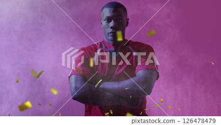 Image of confetti falling over african american male player with arms crossed Image of confetti falling over african american male player with arms crossed 126478479