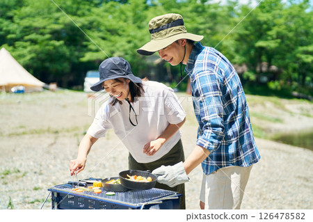 Men and women enjoying barbecue 126478582
