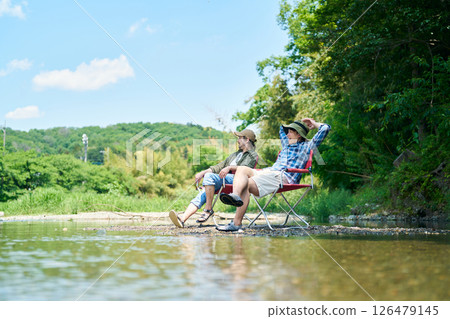 Two men cooling off in the river 126479145