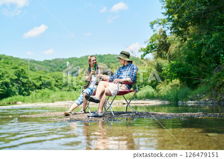 Two men cooling off in the river 126479151