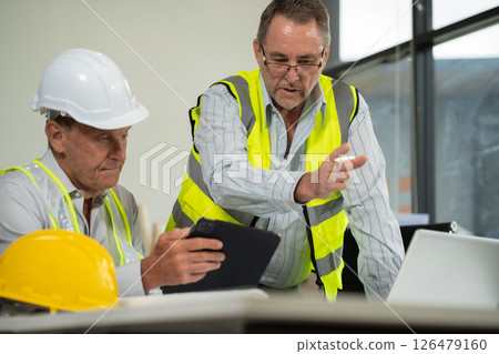 Architect construction engineer plan on hard project at work. 126479160
