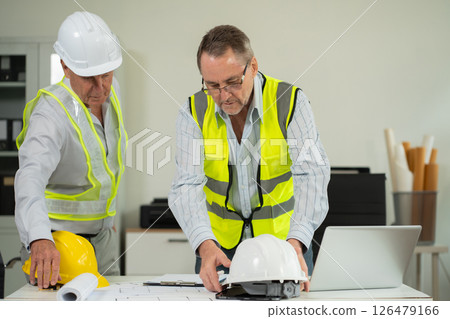 Architect construction engineer plan on hard project at work. 126479166