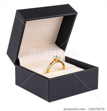 Open wooden gift box with a gold engagement ring Open wooden gift box with a gold engagement ring 126479379