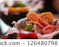Bowl of rice topped with sashimi  126480798