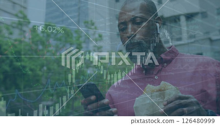 Image of diagrams with data processing over african american casual businessman using smartphone 126480999