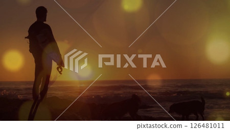 Image of light spots over caucasian man at seaside 126481011