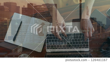 Image of hands of caucasian businesswoman using laptop and taking notes over cityscape Image of hands of caucasian businesswoman using laptop and taking notes over cityscape 126481167