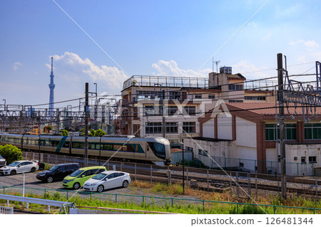 Tobu Express Liberty speeding through the urban area of Sumida Ward 126481344