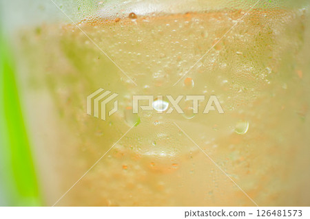 Glass with green background 126481573