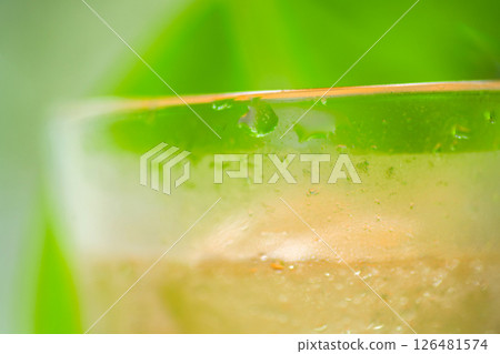 Glass with green background 126481574