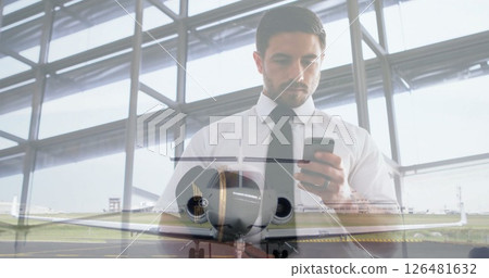 Businessman using smartphone over airplane image at airport terminal 126481632