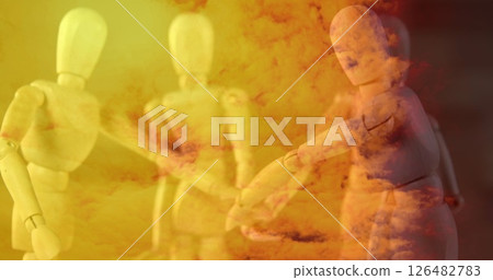 Wooden mannequins shaking hands in abstract orange and yellow cloud background 126482783