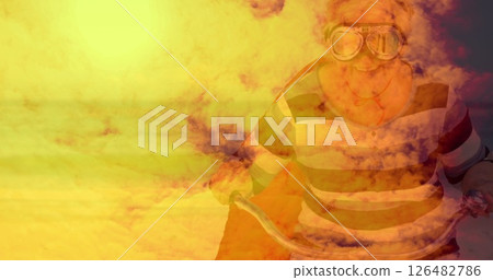 Elderly person wearing goggles riding bicycle through vibrant, dreamy landscape 126482786
