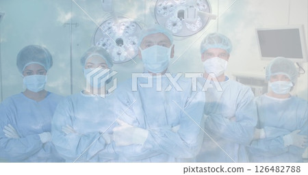 Medical team in surgical scrubs standing confidently in operating room 126482788