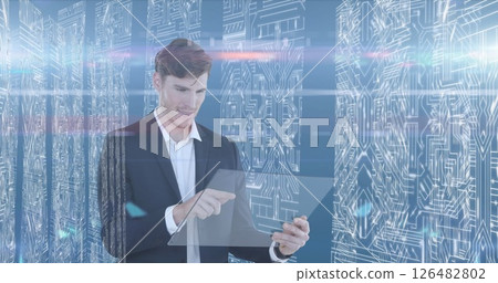 Using transparent tablet, businessman focused on technology in futuristic environment Using transparent tablet, businessman focused on technology in futuristic environment 126482802