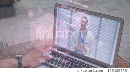 Video call with doctor on laptop, hand typing on keyboard, telemedicine concept 126482859