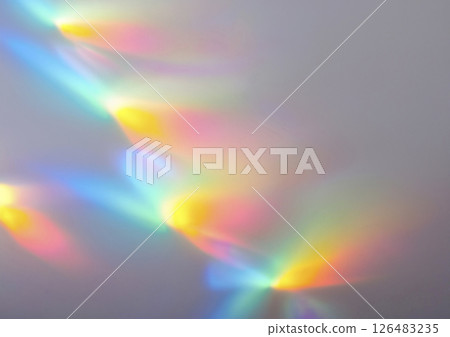 Rainbow-colored light shines through. Complex, overlapping light reflections 126483235