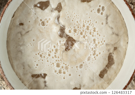 Activation of wet fresh yeast in warm water with sugar. Activation of wet fresh yeast in warm water with sugar. 126483317