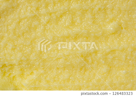 Shiny Golden Ghee Butter Texture Close Up Top View 126483323