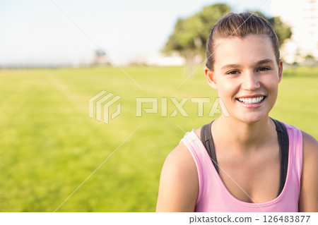 Smiling woman in pink tank top enjoying morning exercise in sunny park, copy space Smiling woman in pink tank top enjoying morning exercise in sunny park, copy space 126483877