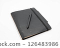 Black notebook and pen 126483986
