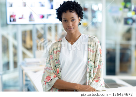 Confident woman standing in modern office, wearing floral kimono and white shirt, copy space Confident woman standing in modern office, wearing floral kimono and white shirt, copy space 126484672
