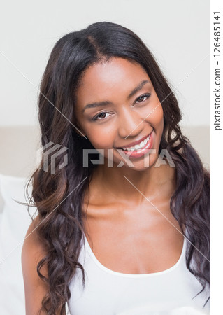 Smiling African American woman relaxing at home, enjoying peaceful moment 126485141