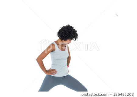 Woman stretching in workout gear, focusing on fitness and flexibility 126485208